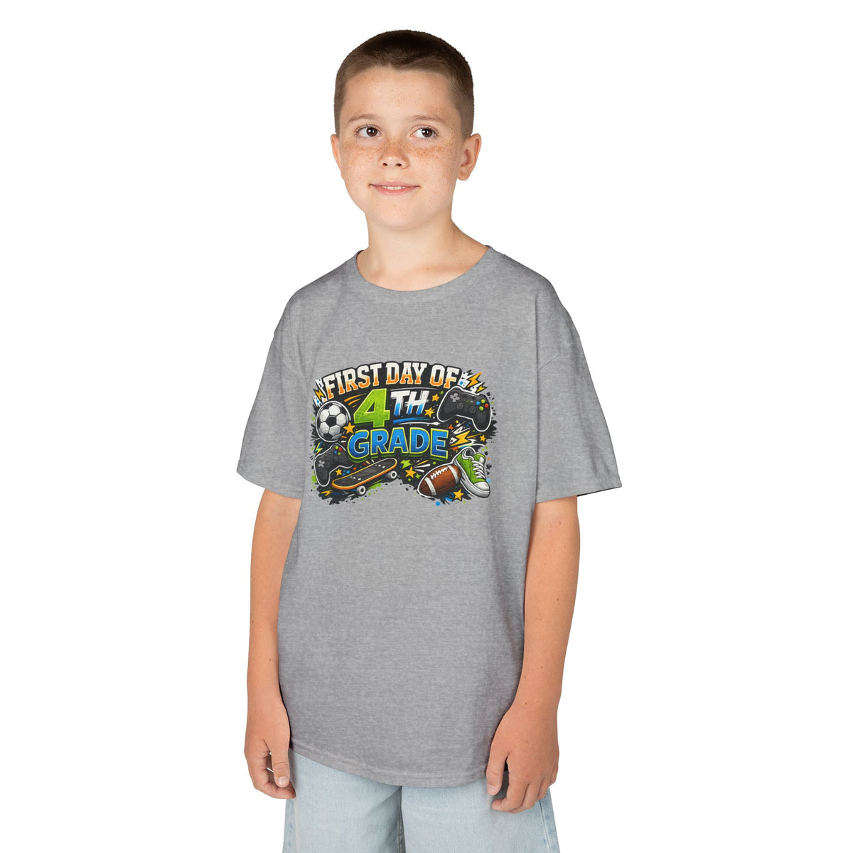 A child wearing a heather gray short-sleeve t-shirt with a colorful 'First Day of 4th Grade' graphic on the chest, standing against a plain white background.