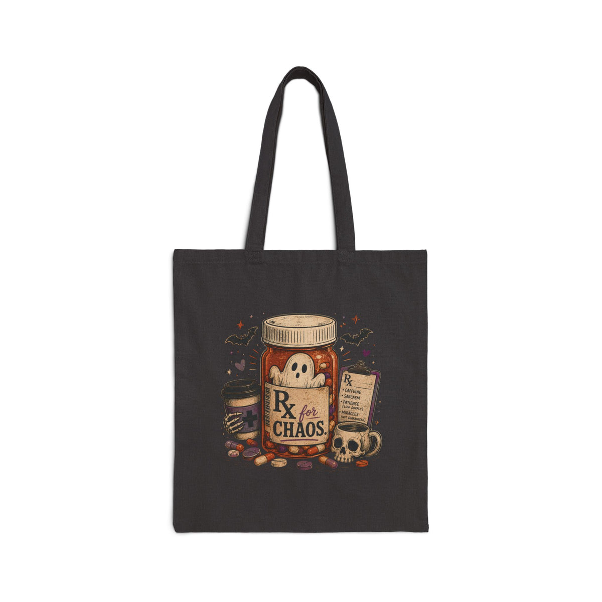 A dark charcoal gray canvas tote bag with black handles, featuring a Halloween-themed graphic print of a jar labeled 'Rx for CHAOS' surrounded by a skull, mug, candy, and potion bottle.
