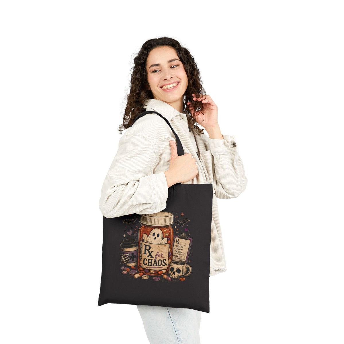Woman holding a black tote bag with a cartoon character and text on a white background