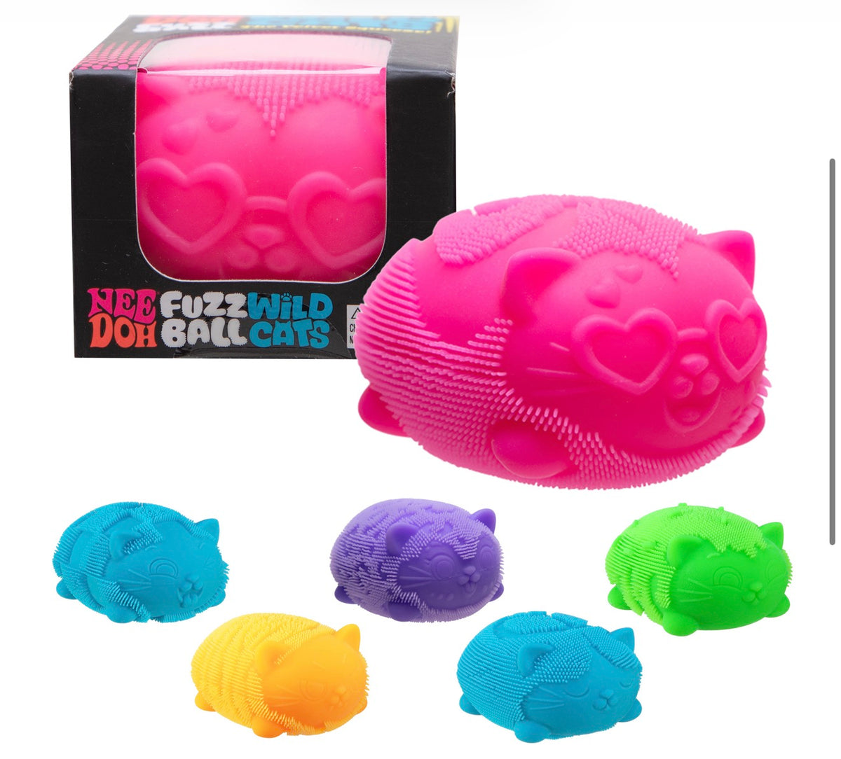 A pink Nee Fuzz Wild Ball Cat dog toy with a textured, ridged surface and heart-shaped details, shown next to its black retail box. Five additional toy balls in blue, purple, yellow, and green are arranged below on a white background.