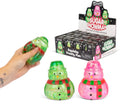 A hand holds a green glittery squishy snowman toy, with two more snowman stress toys in front and a display box labeled 'Sugared Snowman' in the background on a white studio backdrop.