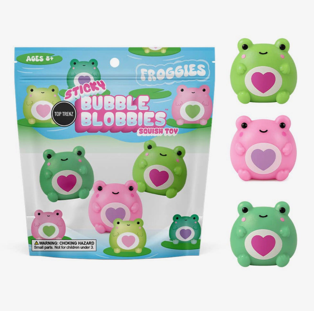 A package of 'Froggies' Sticky Bubble Blobbies Squish Toy alongside three individual frog-shaped squish toys showing different colored belly hearts: green with a pink heart, pink with a purple heart, and green with a pink heart.