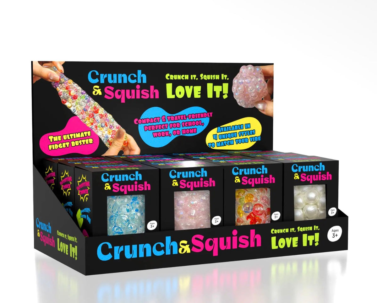 A retail display box of Crunch & Squish sensory beads, showing multiple colorful bead compartments and a large front panel with product branding and sample bead windows.