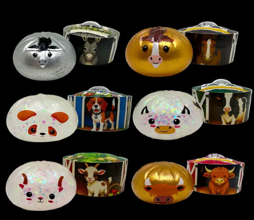 A set of 12 small decorative ornaments shaped like farm animals, arranged in a 3x4 grid against a solid black background. The ornaments include silver, gold, white, brown, and black colors, with some featuring a glittery/iridescent finish.