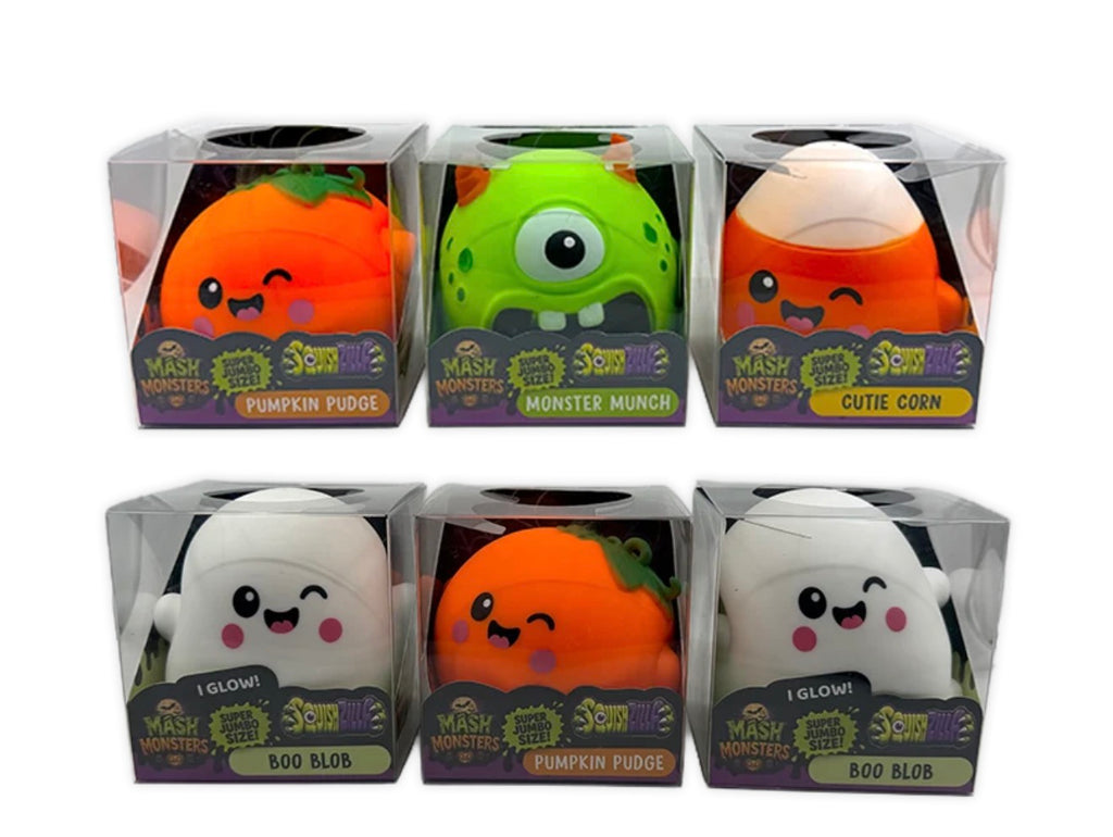 Six packaged squishy plush toys from Mash Monsters, arranged in two rows of three. The characters include Pumpkin Pudge, Monster Munch, Cute Corn, Glow!, Pumpkin Pudge, and Boo Blob, each in a clear plastic box with a branded purple and green label.