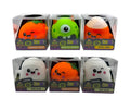 Six packaged squishy plush toys from Mash Monsters, arranged in two rows of three. The characters include Pumpkin Pudge, Monster Munch, Cute Corn, Glow!, Pumpkin Pudge, and Boo Blob, each in a clear plastic box with a branded purple and green label.