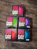 Six boxes of Nee Doh Fuzz Ball pool balls arranged in two rows on a dark wood surface. The boxes feature different colored fuzz balls: pink, green, purple, red, and blue, with the brand name 'NEE DOH' and product name 'FUZZ BALL' clearly visible.