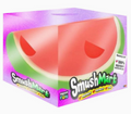 A boxed novelty item featuring a large watermelon slice graphic on the front and the brand name SmushMart on the packaging, photographed against a plain white background.
