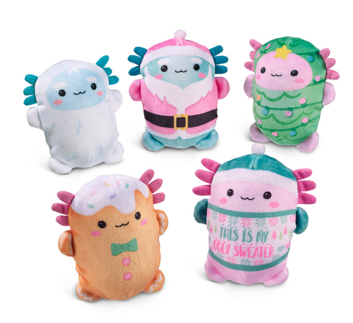 Five cute plush toys arranged on a white background, each with a different colorful design: a pale blue fluffy character, a pink Santa-style character, a green Christmas tree character, an orange character with pink spikes and a bow tie, and a pink character wearing a teal sweater that reads 'THIS IS MY COZY SWEATER'.