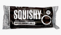 A Squishy Milk Chocolate Bar in its packaging, featuring a dark brown and silver wrapper with white text and a chocolate piece illustration.