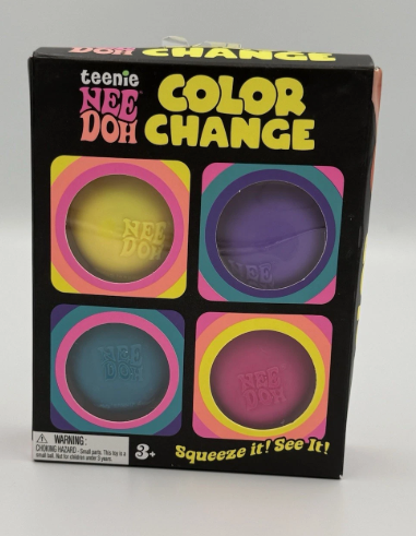 Teenie Nee Doh Color Change makeup kit in its original black packaging, featuring four round squeeze pots with yellow, purple, blue, and pink color-changing makeup visible through square windows.