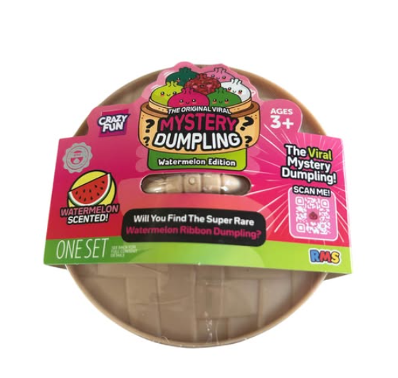 A packaged toy set labeled 'Mystery Dumpling' in Watermelon Edition, shown on a plain white background. The product includes a round beige plastic container under a bright pink and green cardboard sleeve with watermelon-themed graphics and text.