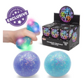A hand squeezes a galaxy-themed light-up stress ball that glows with blue, green, and pink lights. Two more unlit balls are shown below, one purple and one blue, with a black display box of 'Galaxy Light Up Stress Balls' on the right.