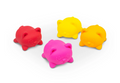 Four small cat-shaped squishy toys in red, pink, yellow, and orange, arranged on a clean white background.