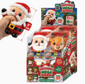 A hand holds a small squishy Santa Claus toy next to a retail display box of 'Squishmas Mega Squish' collectible squishies. The image includes red measurement arrows and text indicating the toy is 5 inches tall.