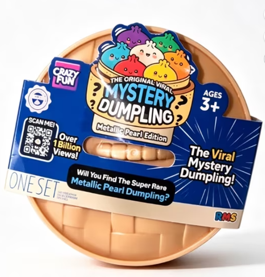 A Crazy Fun Metallic Pearl Dumpling toy package with a round beige dumpling shell and a blue cardboard insert featuring colorful cartoon dumplings and promotional text.