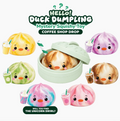 Promotional graphic for a 'HELLO! Duck Dumpling' mystery squishy toy, showing a light green bamboo-style round container with a duck-face dumpling peeking out, surrounded by six cute illustrated dumplings in different colors and drink accessories, with text reading 'Mystery Squishy Toy' and 'Coffee Shop Drop'.