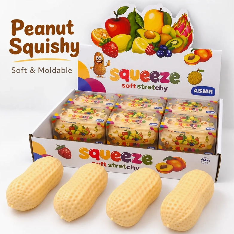 Four beige peanut-shaped squishy toys displayed in front of a branded retail display box labeled 'Peanut Squishy' and 'squeeze soft stretchy'. The box features colorful fruit illustrations and the ASMR logo.