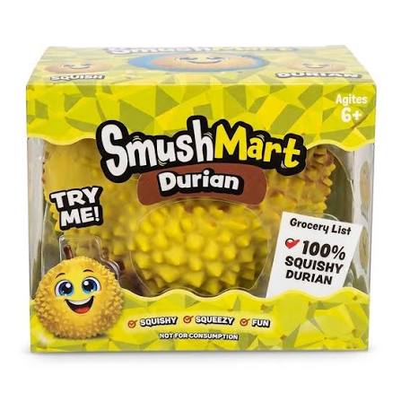 SmushMart Durian toy packaging box containing a yellow spiky squishy toy, with cartoon graphics and text including 'TRY ME!' and 'Grocery List 100% SQUISHY DURIAN'.